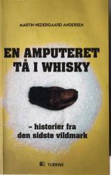 Billede af bogen En amputeret tå i whisky - historier fra den sidste vildmark