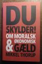 Billede af bogen Du skylder - Om moralsk & økonomisk gæld 