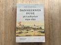 Billede af bogen Danskernes huse på Guldkysten 1659-1850