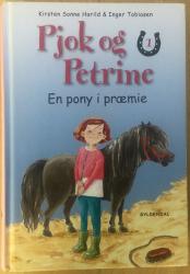 Billede af bogen Pjok og Petrine 1 - En pony i præmie