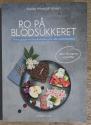 Billede af bogen Ro på blodsukkeret. Trinvis guide til kulhydrattælling for alle med diabetes.