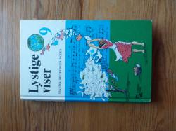 Billede af bogen Lystige viser 9 - tekster, noder, becifringer Billede af bogen Lystige viser 9 - tekster, noder, becifringer